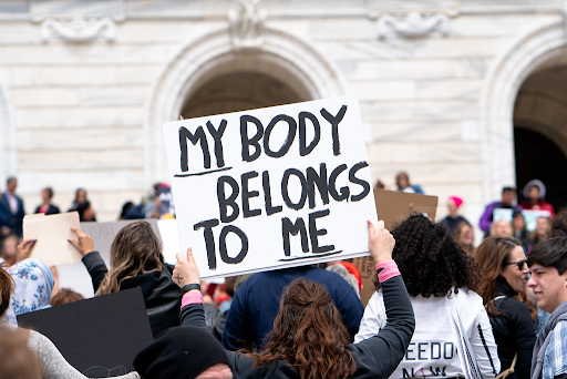 "My Body Belongs To Me sign at a Stop Abortion Bans Rally in St Paul, Minnesota" by Lorie Shaull. Licensed under CC BY-SA 2.0.