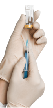 Medical professional filling a syringe. 